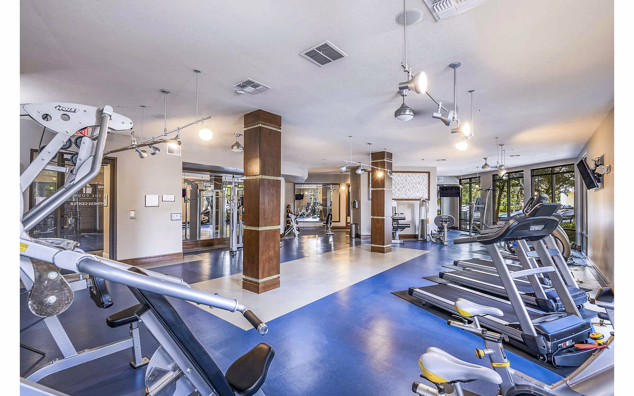 State-of-the-art fitness center with modern equipment at The Four Apartments