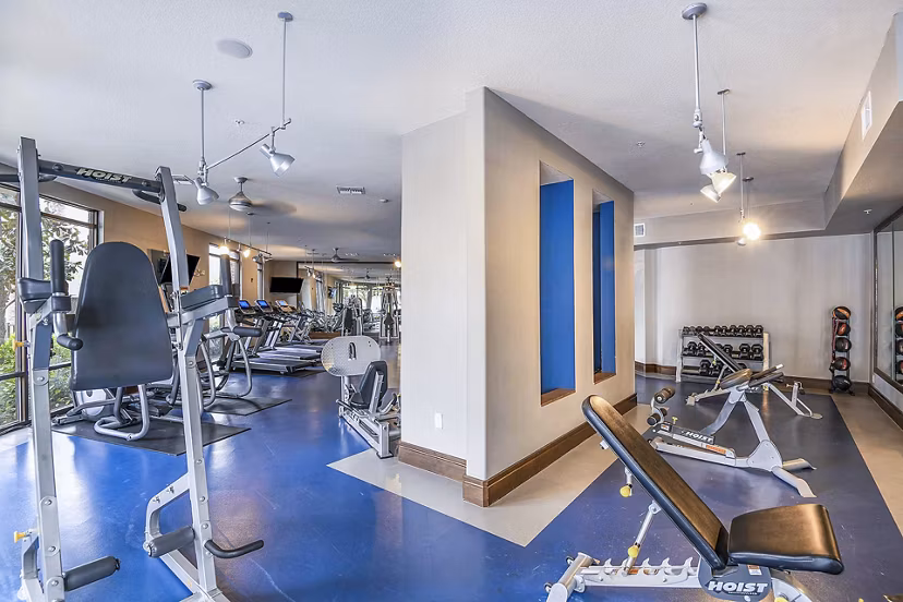 State-of-the-art fitness center at The Four Apartments featuring modern equipment and exercise spaces