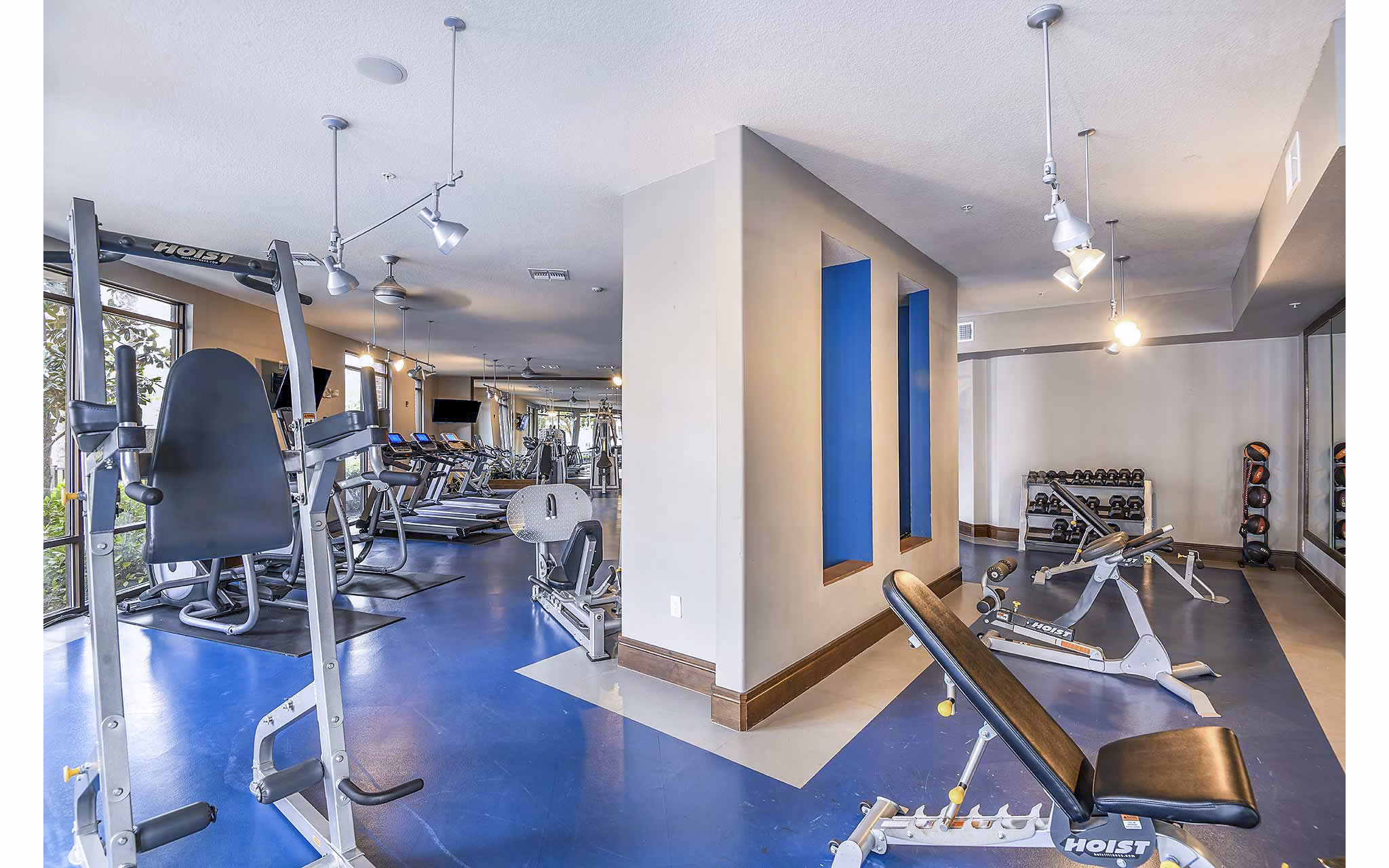 State-of-the-art fitness center at The Four Apartments featuring modern equipment and exercise spaces
