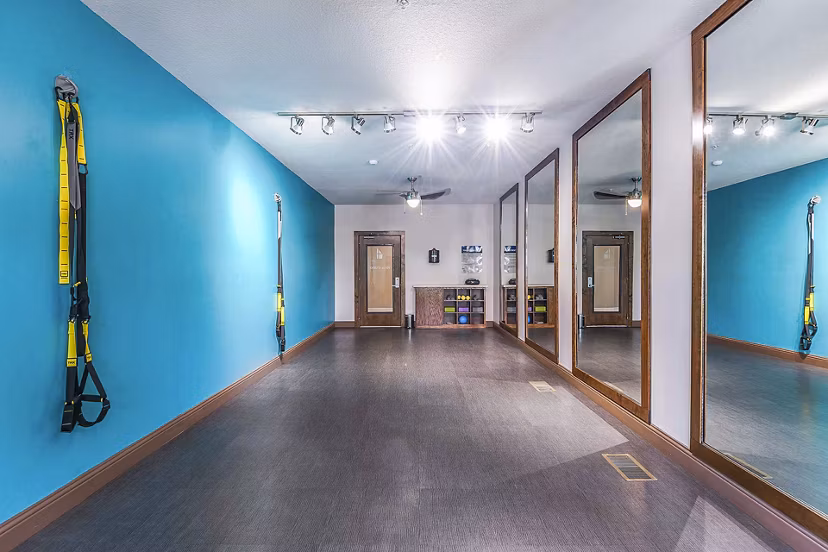 Modern fitness center with state-of-the-art equipment at The Four Apartments