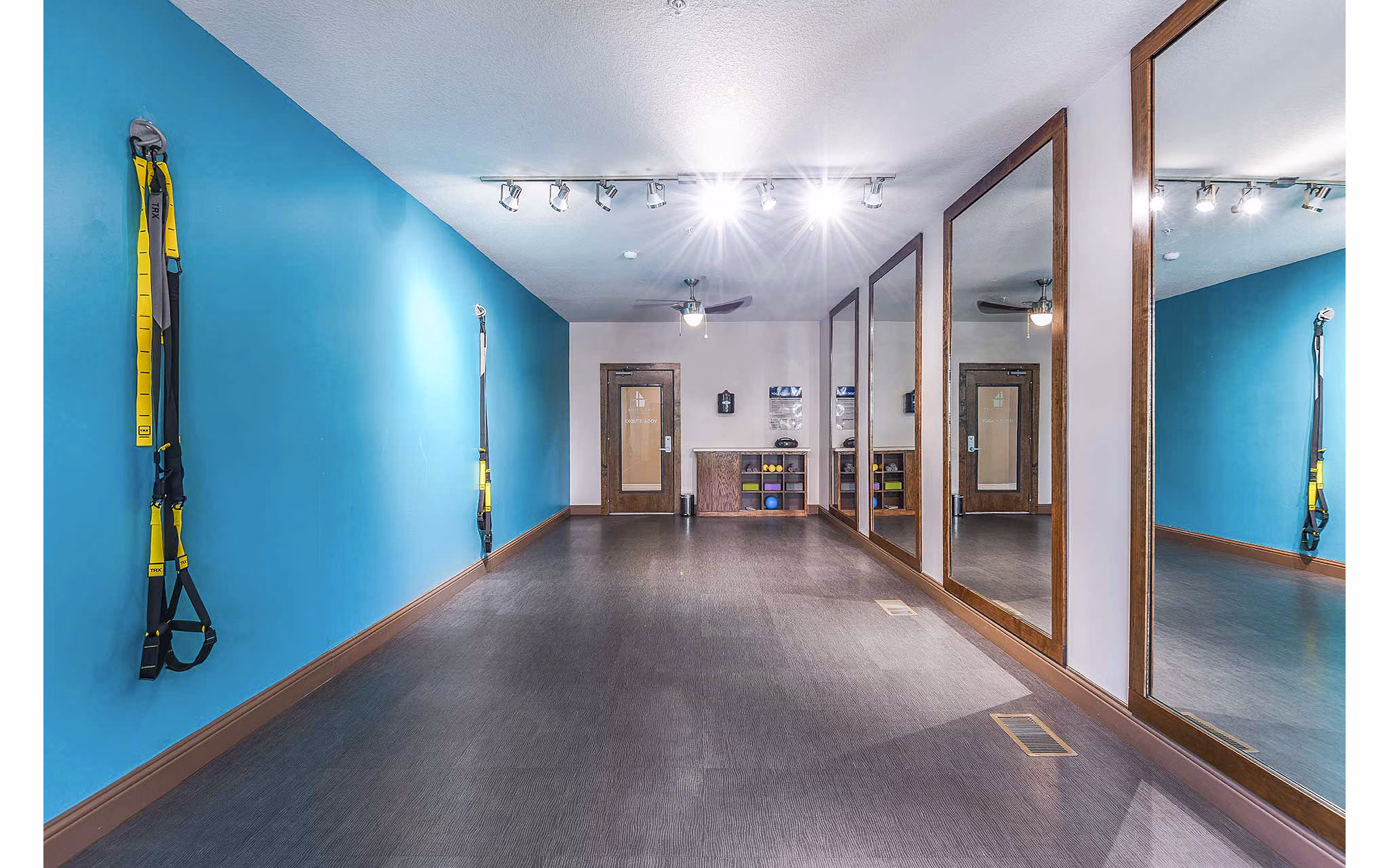 Modern fitness center with state-of-the-art equipment at The Four Apartments