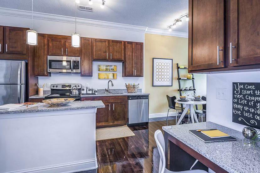 Modern kitchen with sleek countertops and home office space at The Four Apartments, ideal for luxury urban living and working from home