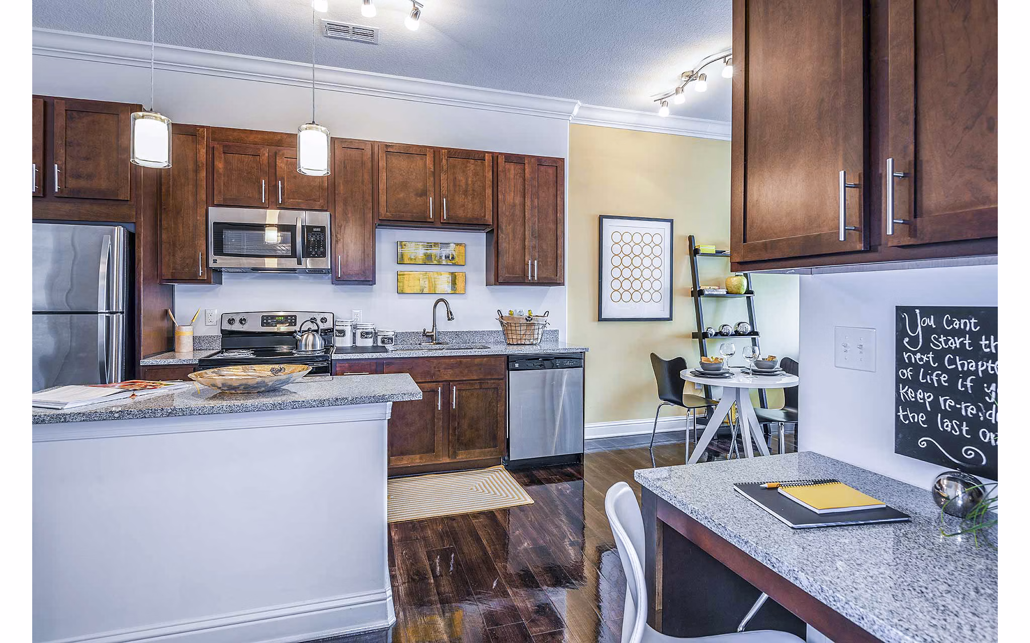 Modern kitchen with sleek countertops and home office space at The Four Apartments, ideal for luxury urban living and working from home