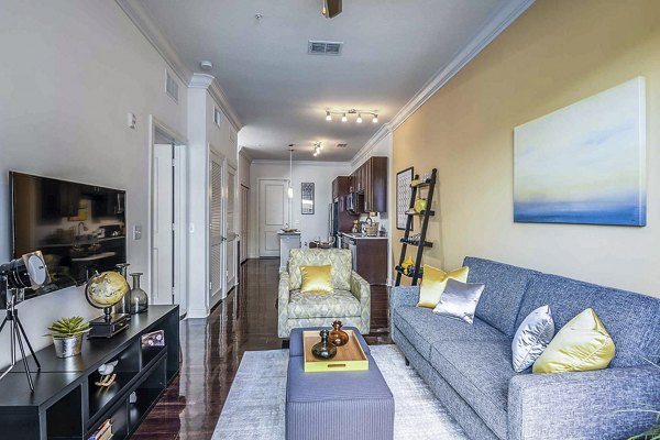 Cozy living room with modern furnishings in The Four Apartments