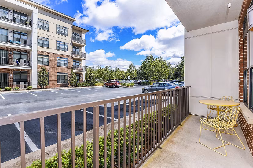 Chic patio at The Four Apartments featuring stylish seating and cityscape views