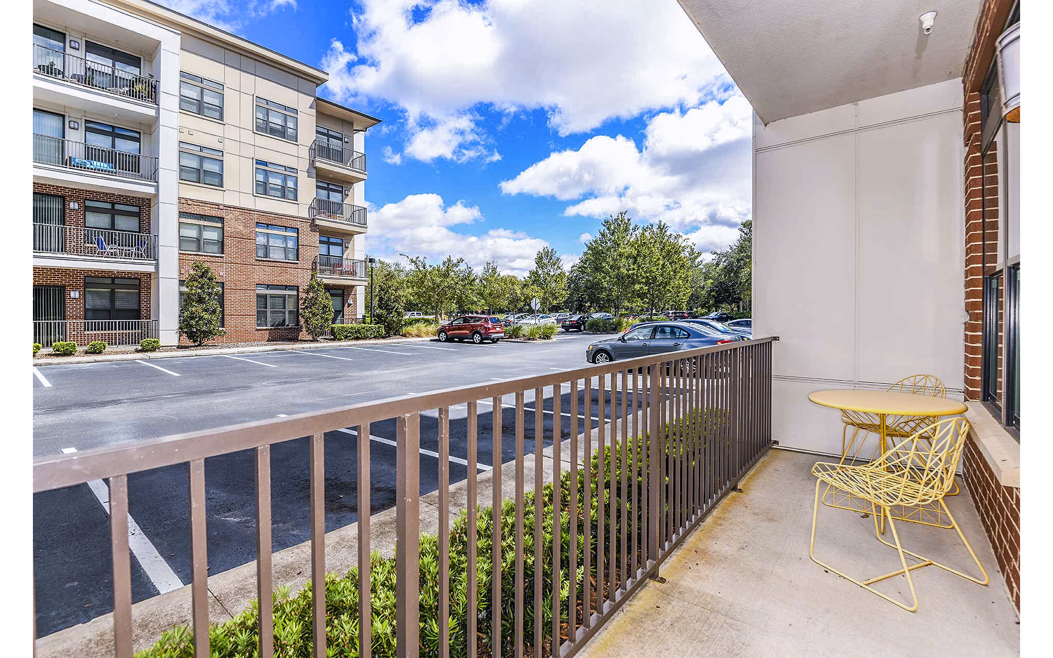Chic patio at The Four Apartments featuring stylish seating and cityscape views