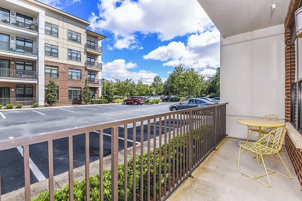Chic patio at The Four Apartments featuring stylish seating and cityscape views