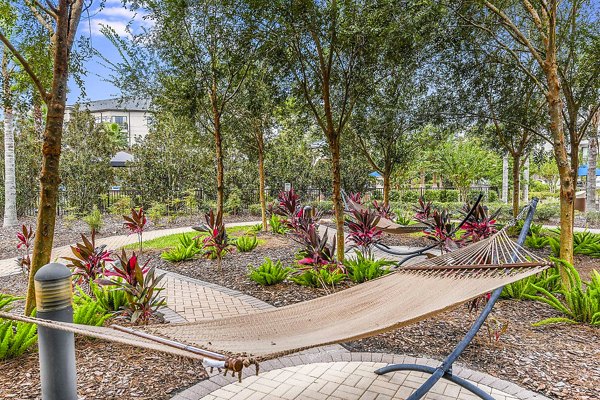 Hammock retreat for relaxation at The Four Apartments: Luxurious outdoor amenity space