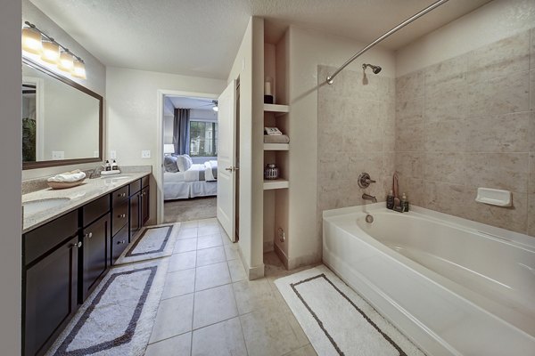 Modern bathroom with sleek fixtures and elegant lighting at 33 West Apartments, a luxury property by Greystar