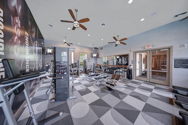 State-of-the-art fitness center equipped with modern exercise machines at 33 West Apartments