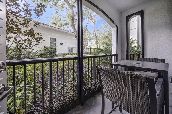 Modern outdoor patio at 33 West Apartments with stylish seating and lush landscaping, offering a perfect relaxation spot for residents