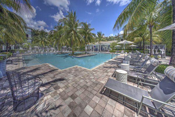 Rooftop pool with luxurious lounge seating at 33 West Apartments offering scenic skyline views