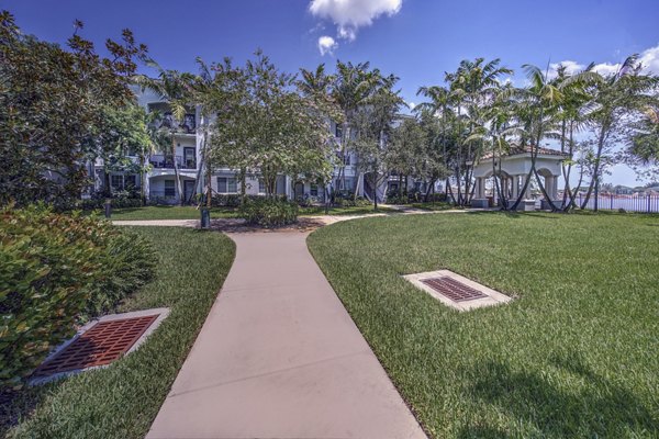 Landscaped courtyard at 33 West Apartments with seating areas and green spaces