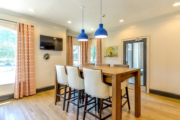 Modern clubhouse with stylish seating and billiards table at Townhouse Atlanta luxury apartments