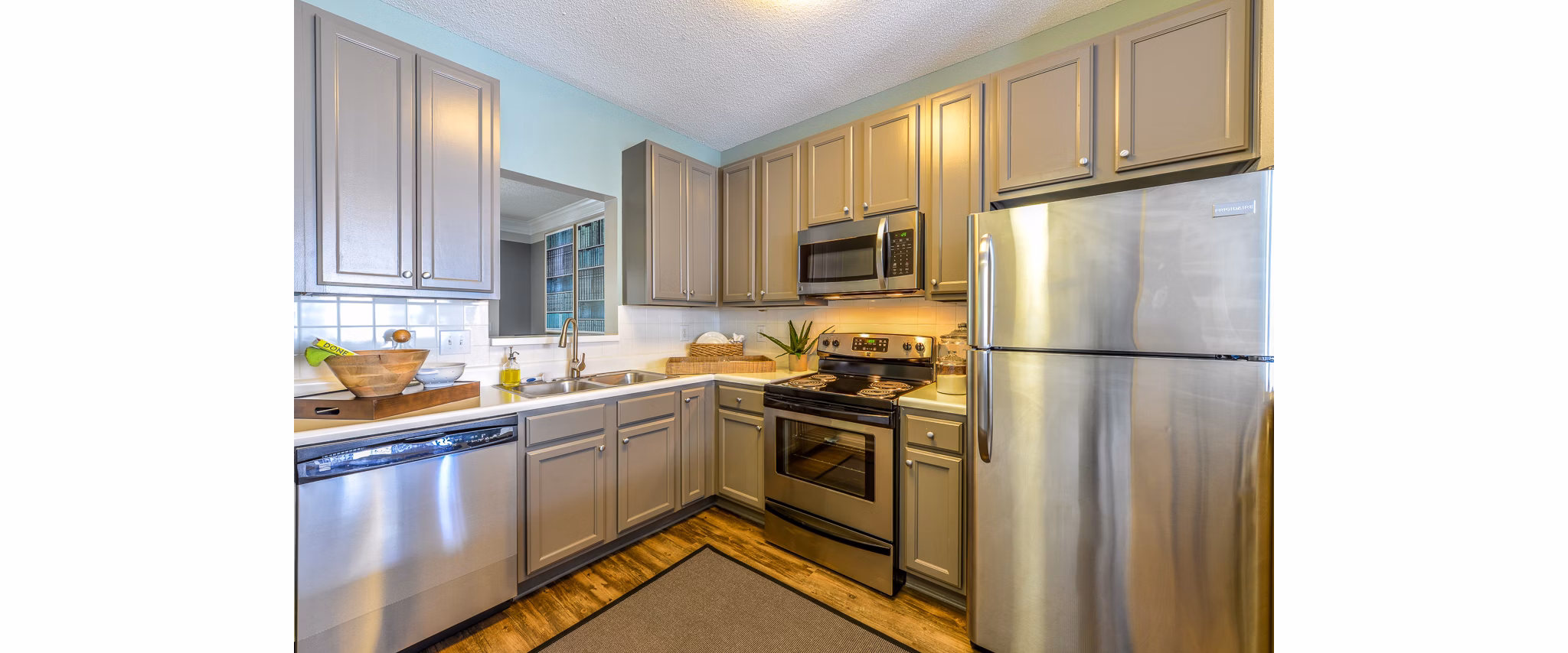 Modern kitchen with stainless steel appliances at Townhouse Atlanta apartments