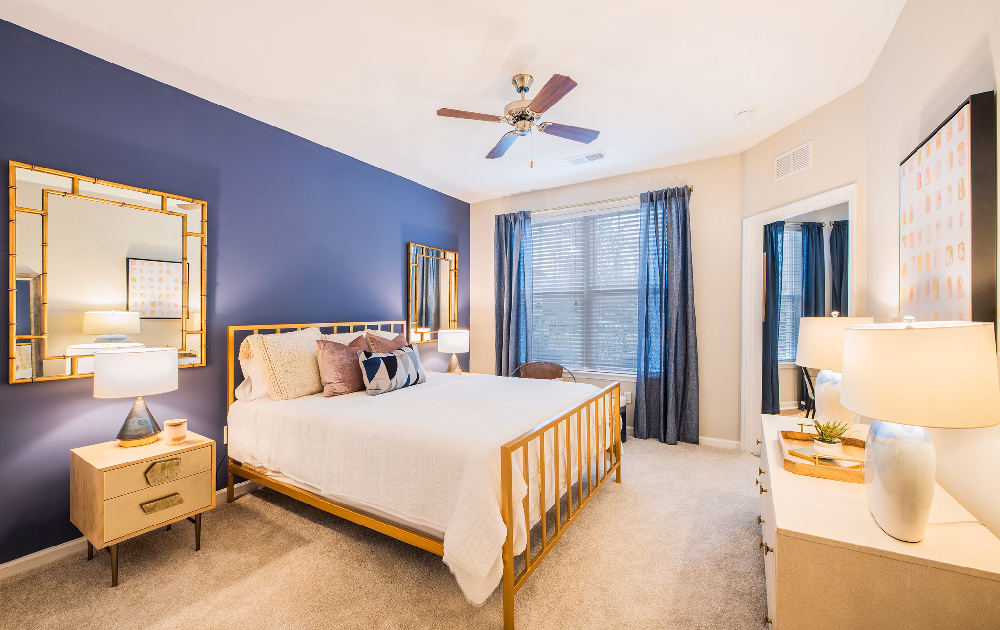 Bedroom featuring modern decor and large windows at Element Carolina Bay Apartments