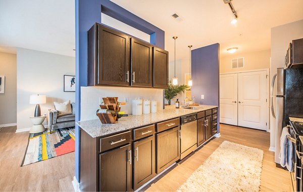 Element Carolina Bay Apartments: Modern clubhouse with vibrant seating and sleek decor in the luxurious Element Carolina Bay community