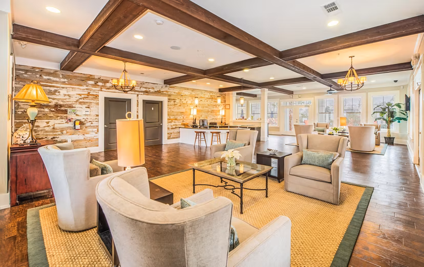 Modern clubhouse at Element Carolina Bay Apartments with elegant lounge areas and state-of-the-art amenities
