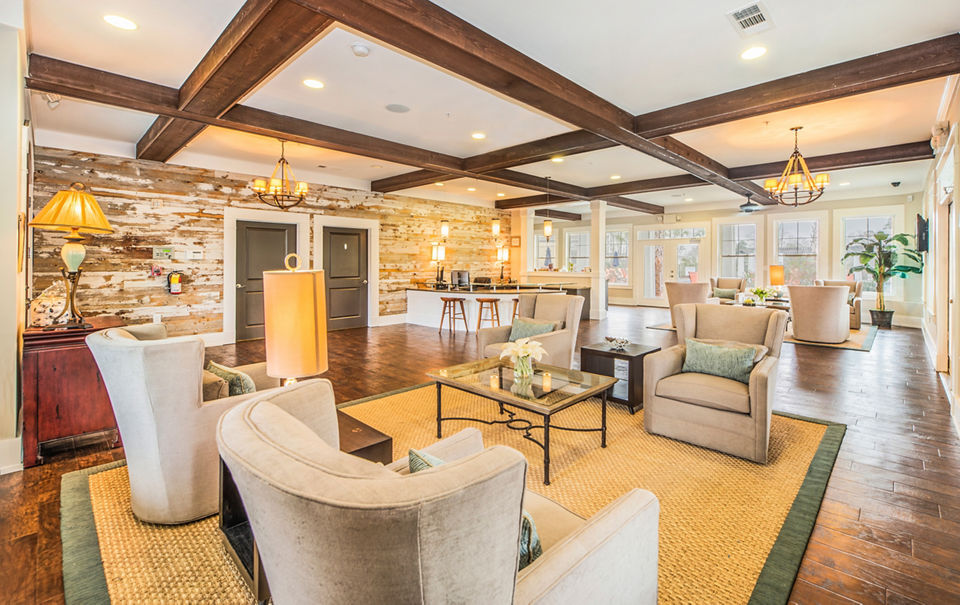 Modern clubhouse at Element Carolina Bay Apartments with elegant lounge areas and state-of-the-art amenities