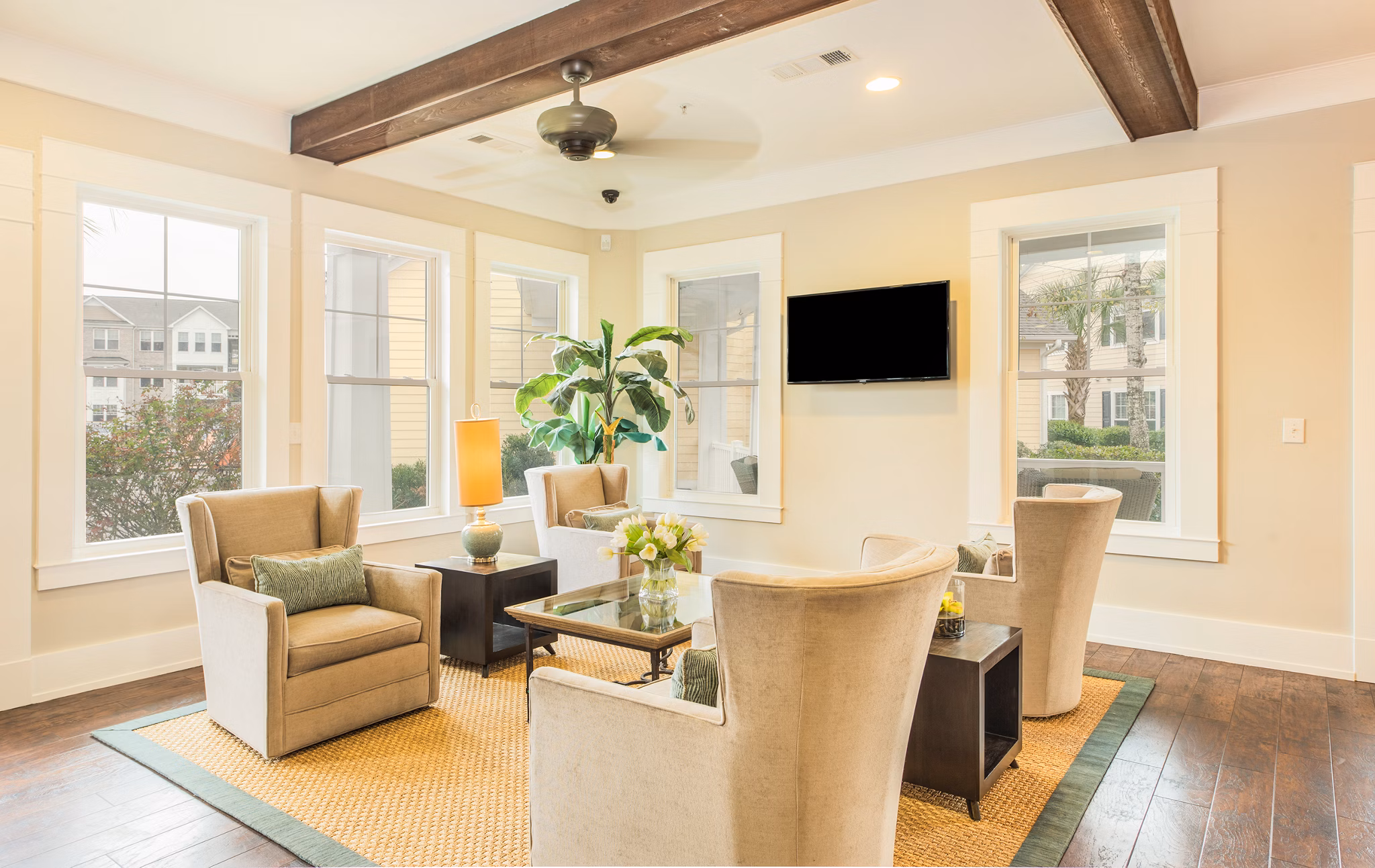 Clubhouse featuring modern design and cozy seating at Element Carolina Bay Apartments in Charleston, South Carolina