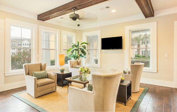 Clubhouse featuring modern design and cozy seating at Element Carolina Bay Apartments in Charleston, South Carolina