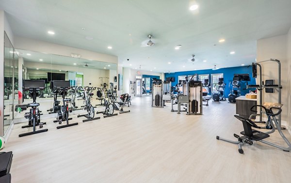 State-of-the-art fitness center at Element Carolina Bay Apartments with modern equipment for an optimal workout experience