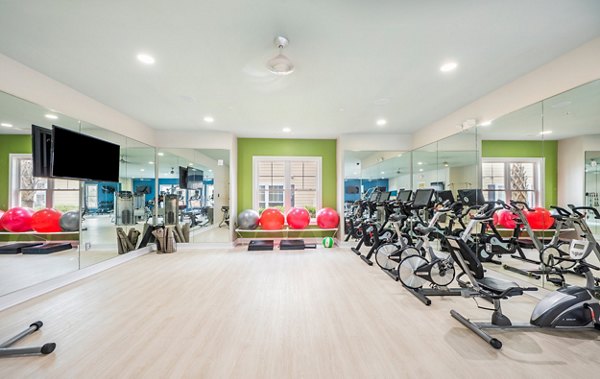 Yoga and spin studio with modern equipment at Element Carolina Bay Apartments, perfect for active lifestyles and wellness pursuits