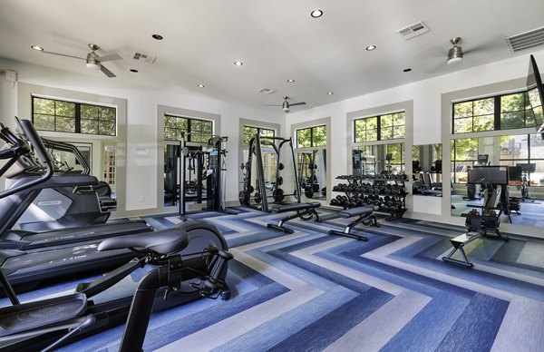 Fully-equipped fitness center with modern machines at 3500 Westlake Apartments, offers residents top-notch workout options