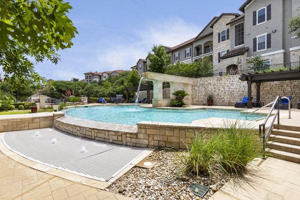 Resort-style pool with lounge seating at 3500 Westlake Apartments