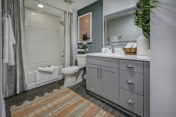 Modern bathroom featuring sleek fixtures and designer tiles at Solmar on 6th luxury apartments