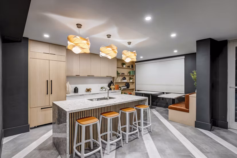Modern spacious clubhouse with lounge seating and pool table at Solmar on 6th luxury apartments
