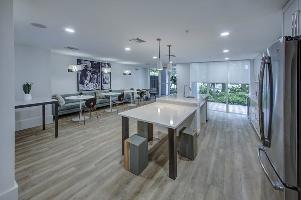 Modern spacious clubhouse with lounge seating and pool table at Solmar on 6th luxury apartments