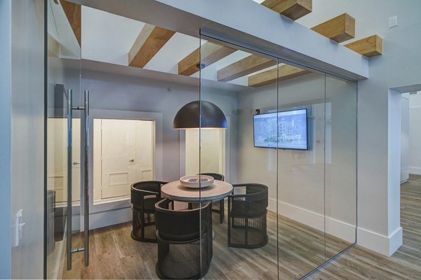 Modern meeting facility with plush seating and natural lighting at Solmar on 6th luxury apartments