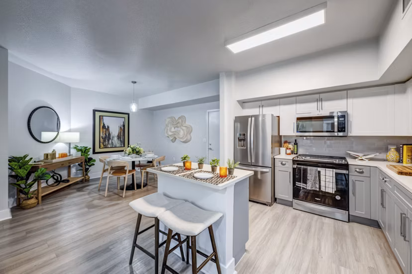 Modern kitchen with sleek appliances and granite countertops at Solmar on 6th luxury apartments