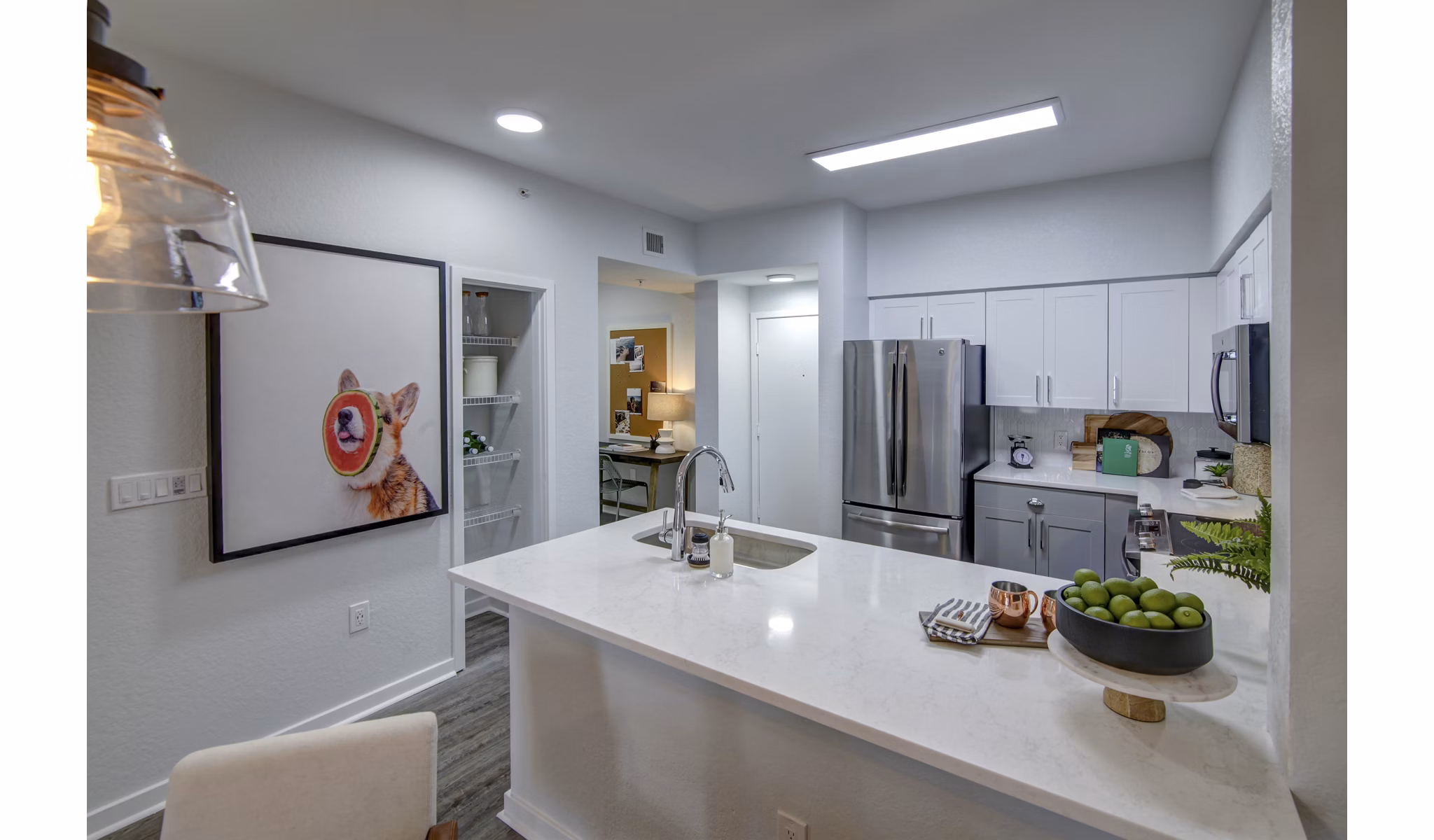 Modern kitchen with stainless steel appliances at Solmar on 6th luxury apartments