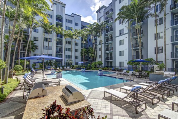 Resort-style pool with sun loungers at Solmar on 6th luxury apartments