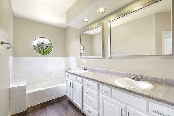 Modern bathroom with sleek fixtures at The Boulevard at Town Lake Apartments