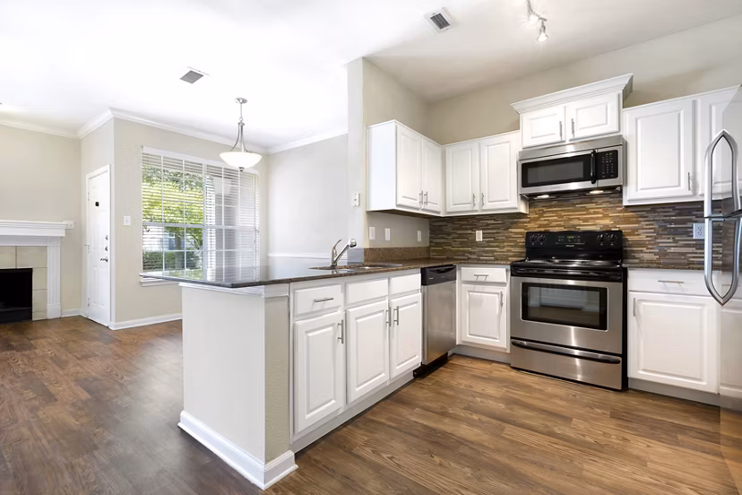 Modern kitchen with stainless steel appliances at The Boulevard at Town Lake Apartments Ideal for luxurious living in a Greystar community