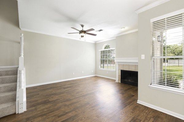 Spacious living room with modern dÃ©cor at The Boulevard at Town Lake Apartments