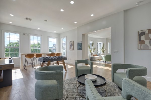 Spacious living room with modern furniture in Archer Stone Canyon Apartments
