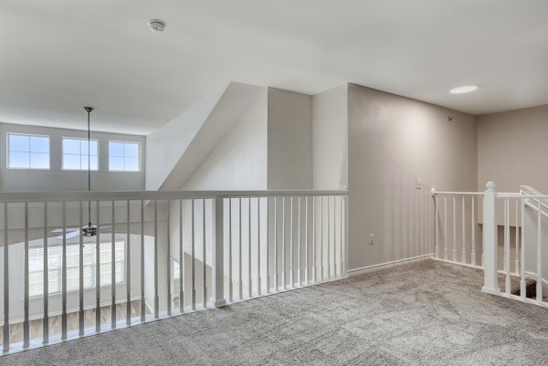 Spacious outdoor patio area featuring modern furniture at Archer Stone Canyon Apartments, perfect for relaxation and socializing