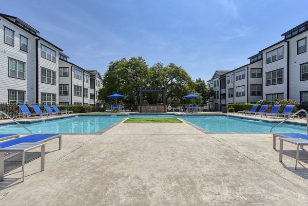 Luxurious pool area at Archer Stone Canyon Apartments offering serene relaxation and modern amenities Perfect for leisure and enjoyment
