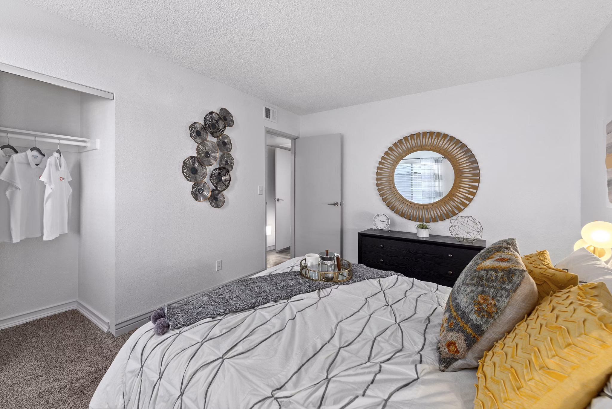 Highland Park Apartments: Cozy bedroom with modern decor and large windows