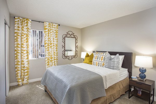 Cozy bedroom featuring elegant decor at Highland Park Apartments