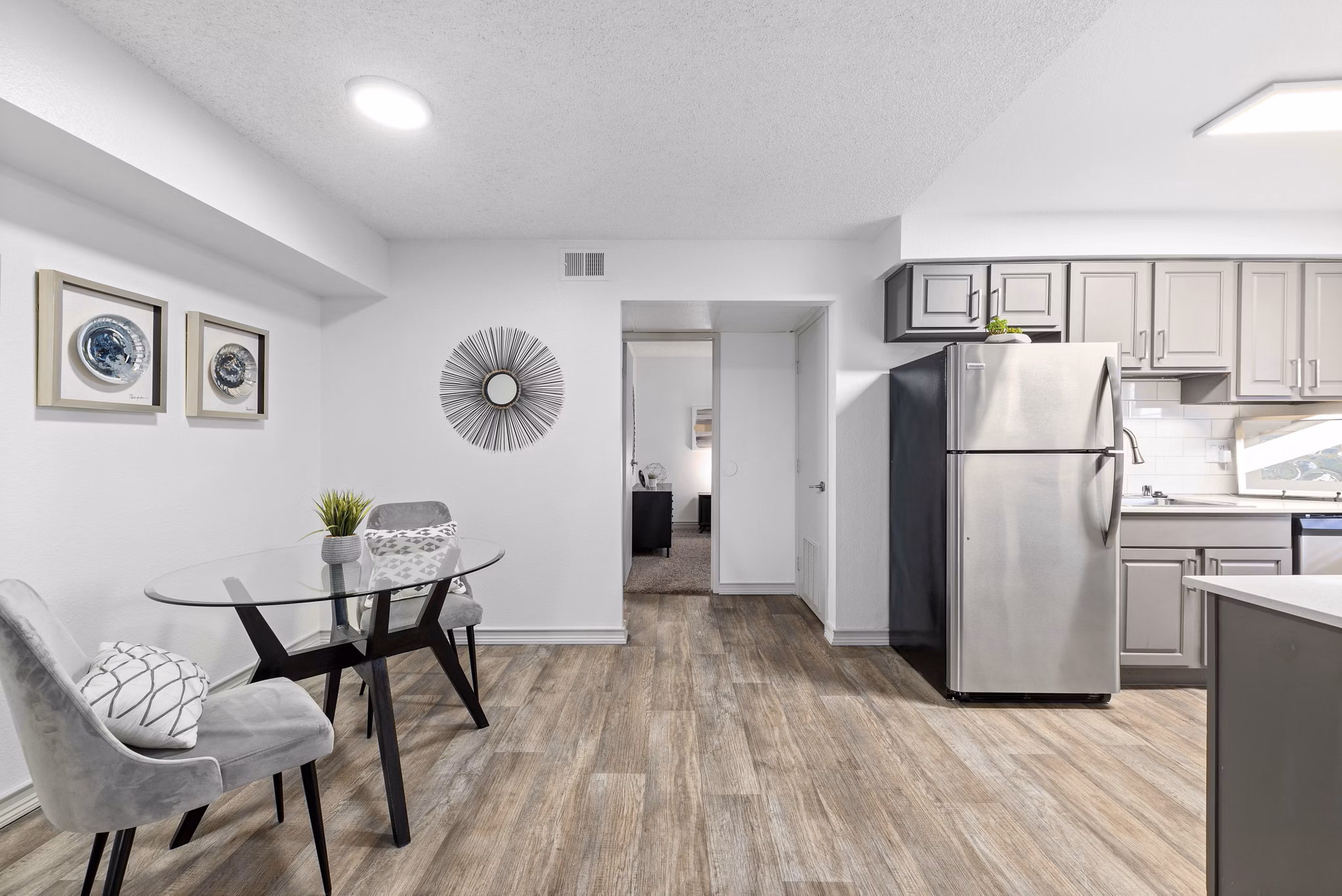 Modern kitchen with sleek countertops and stainless steel appliances at Highland Park Apartments