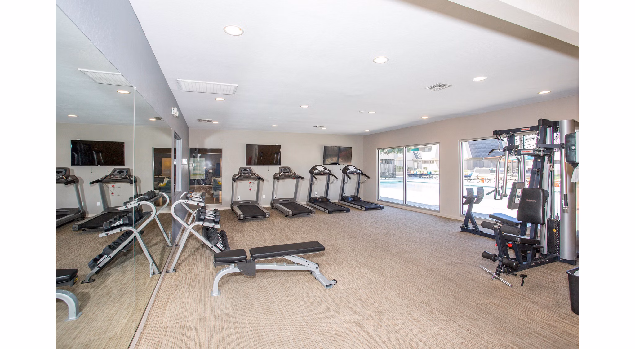 Modern fitness center with state-of-the-art equipment at Highland Park Apartments