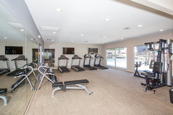 Modern fitness center with state-of-the-art equipment at Highland Park Apartments