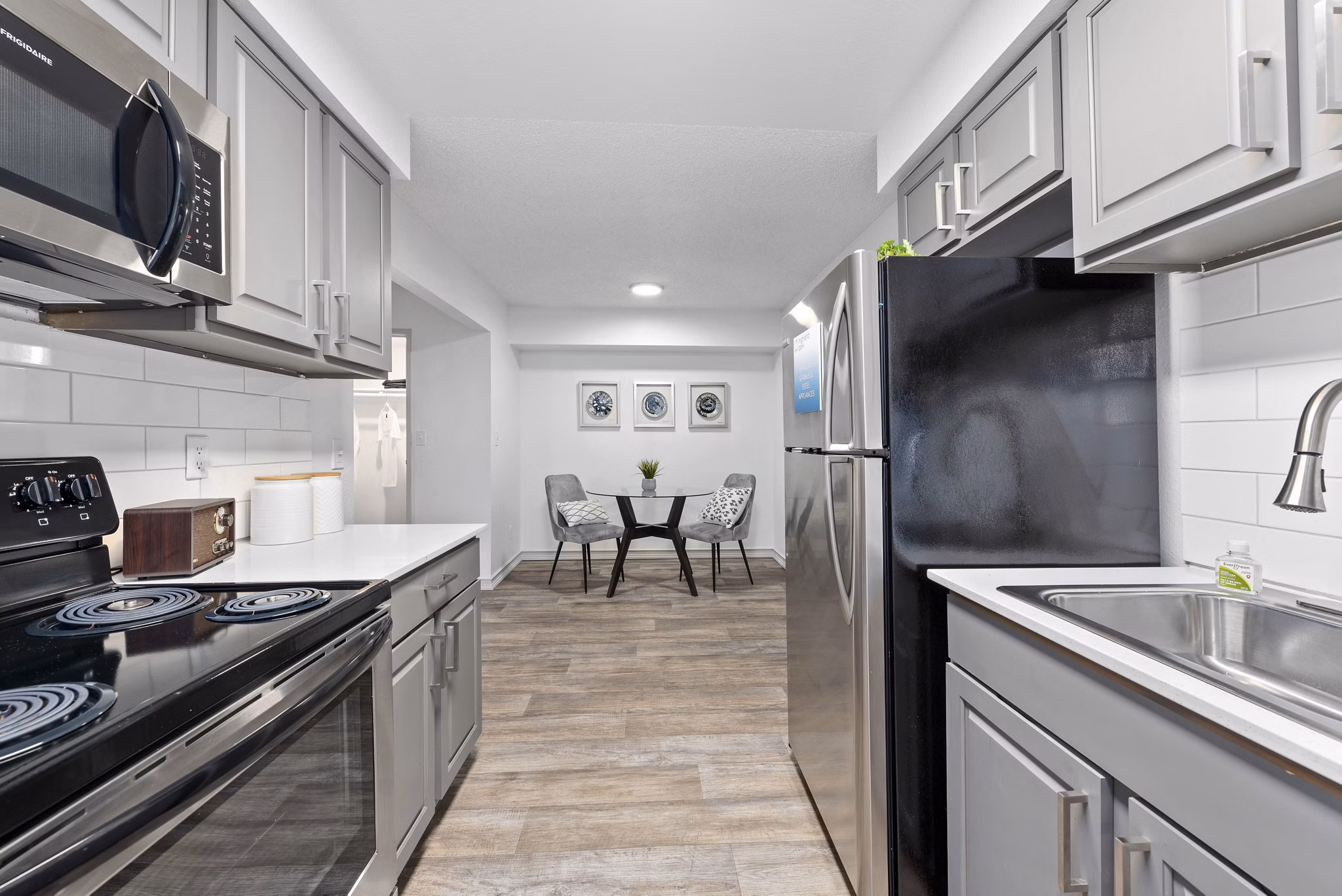 Sleek kitchen design with modern appliances at Highland Park Apartments
