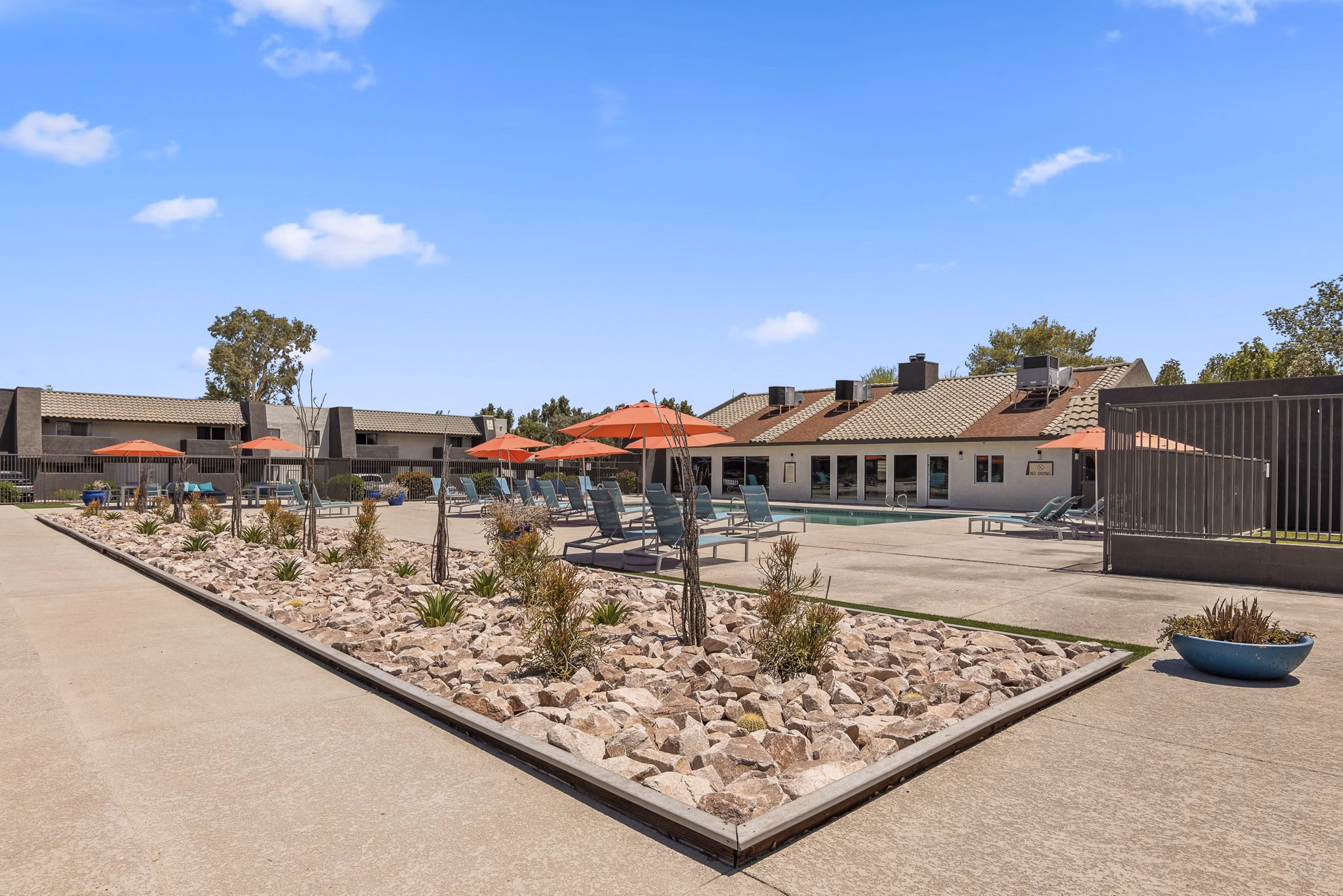 Modern courtyard with grill area and sport court at Highland Park Apartments