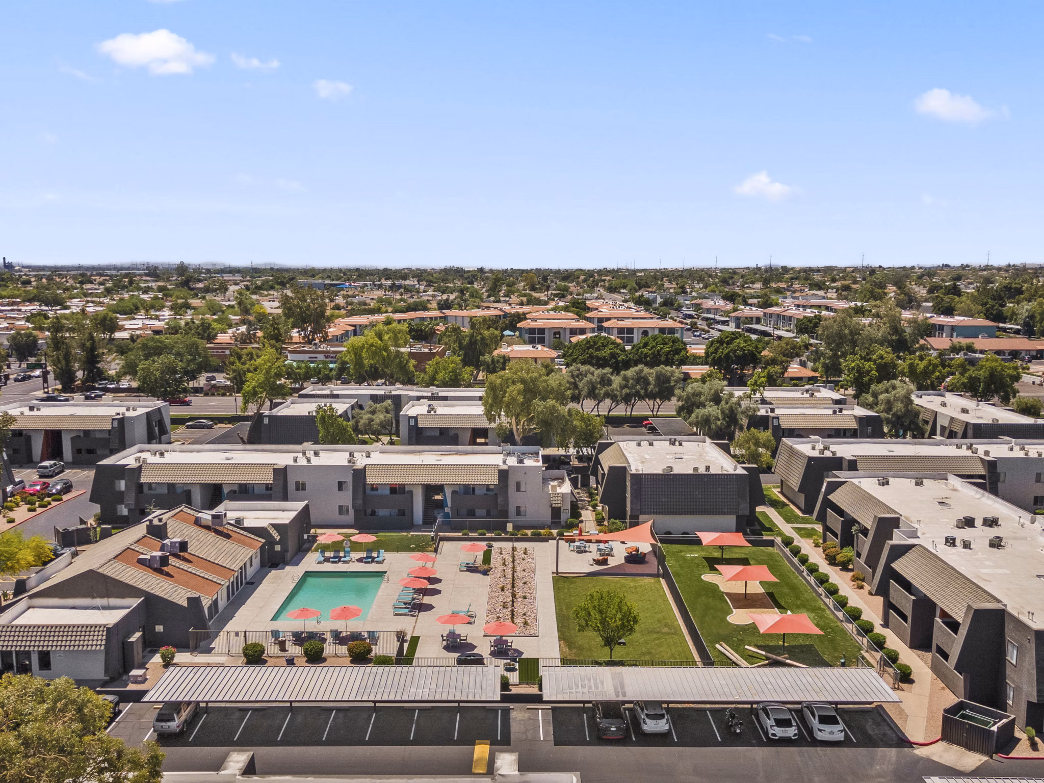 Highland Park Apartments: Expansive outdoor view with lush greenery and walking paths